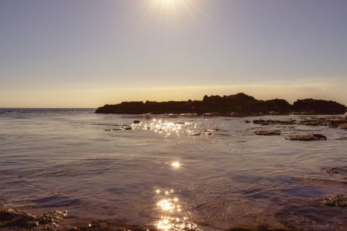 sunset rocky coast reflections