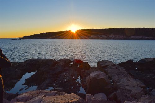 sunset rocks water