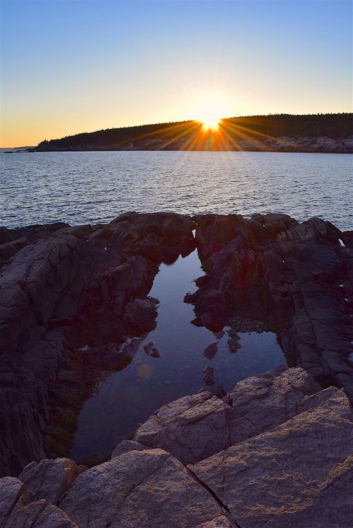 sunset rocks water