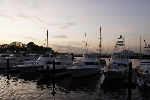 sunset boats water