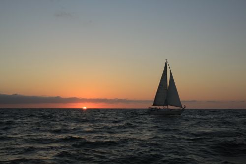 sunset sailboat ocean