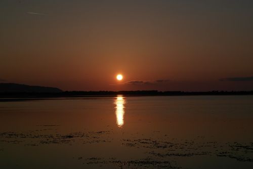 sunset orbetello sea