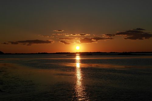 sunset orbetello sea