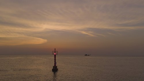 sunset  light tower  ocean