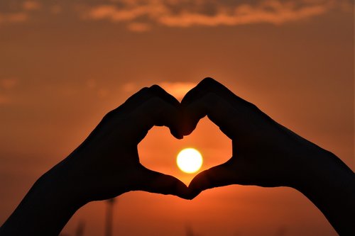 sunset  heart  hands