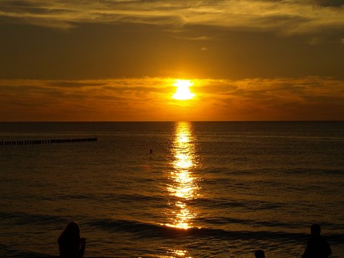 sunset  the baltic sea  the sun