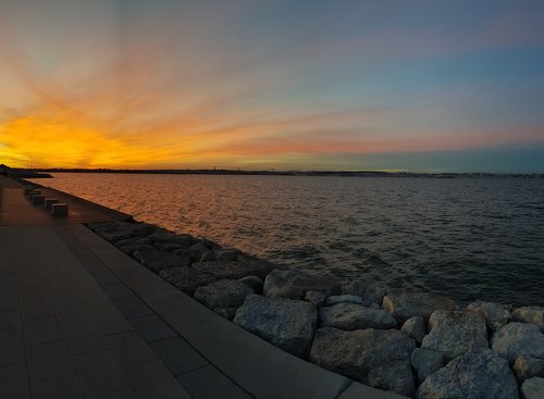 sunset  water  stones