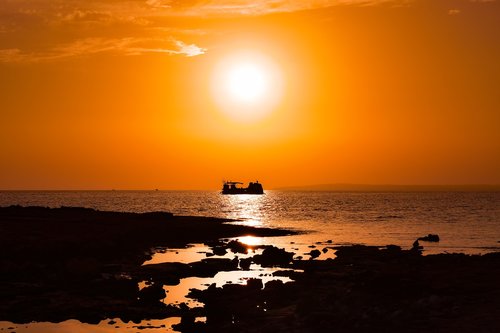 sunset  rocky coast  sun