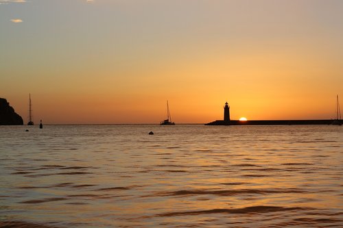 sunset  sailing boat  lighthouse