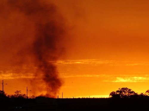 sunset fire smoke