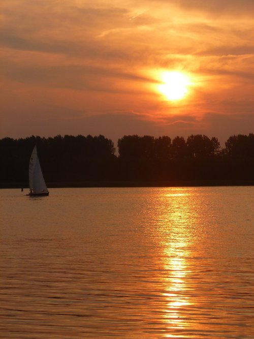 sunset  sailing boat  river