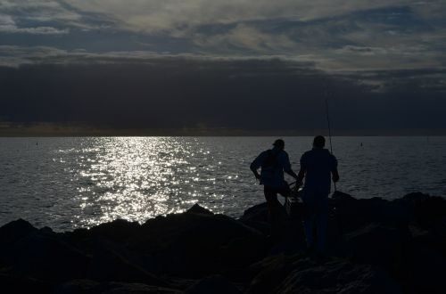 sunset fisherman coast