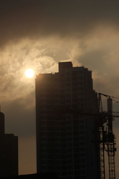 sunset tall buildings sky