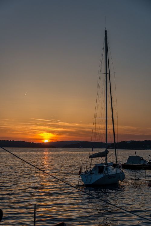 sunset boat ocean