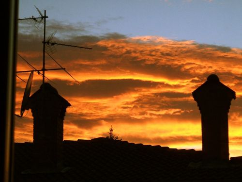sunset clouds roofs