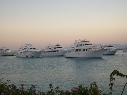 sunset  boats  sea