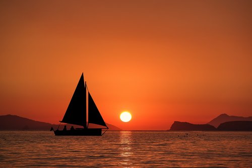 sunset  sailboat  ocean