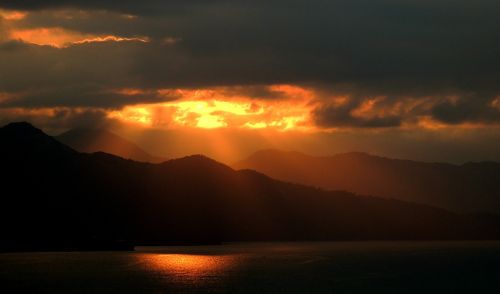 sunset mountains island