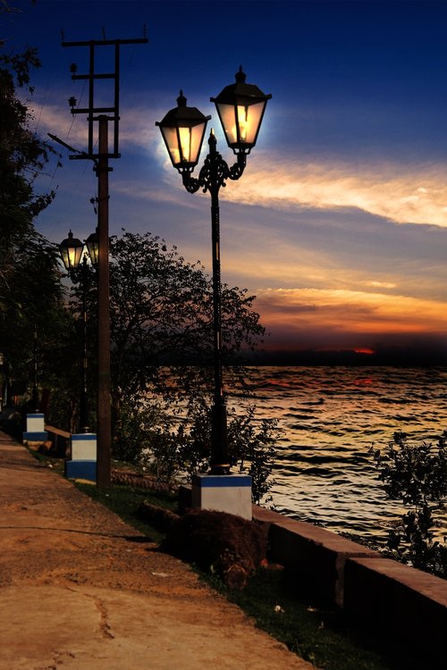 sunset  lamp post  sea