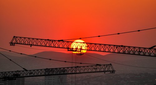 sunset  construction  crane