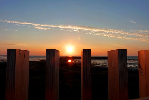 sunset  sea  poles