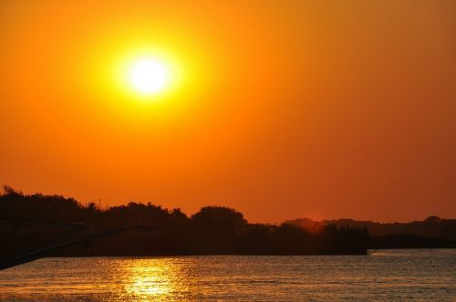 sunset zambezi river zimbabwe