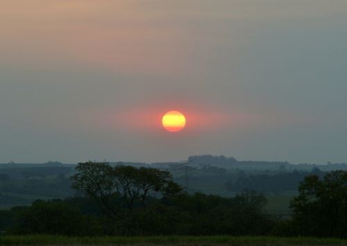 sunset against light clouds