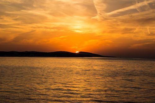 sunset sea island