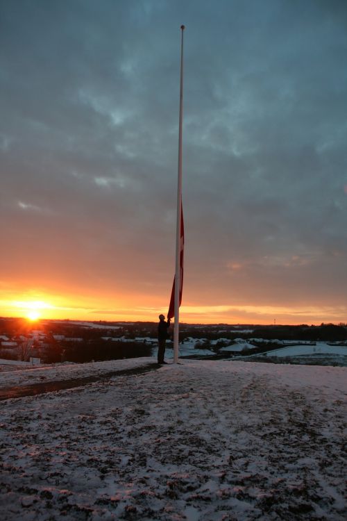 sunset flagpole snow