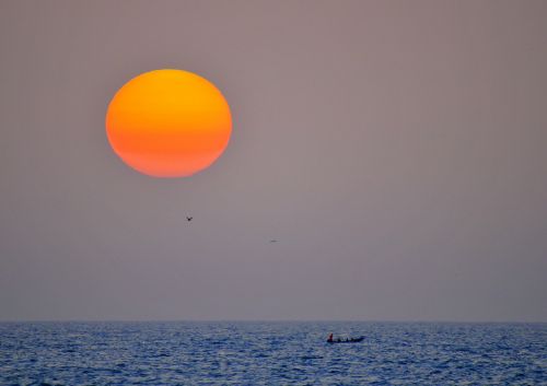 sunset fishermen sea