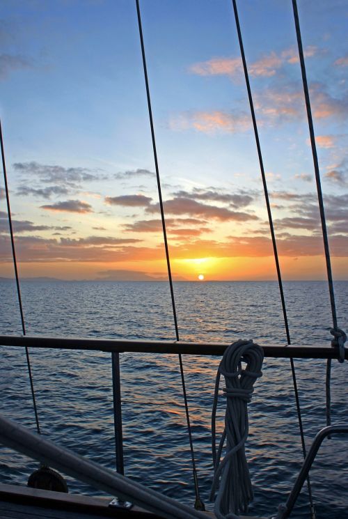 sunset ship ocean