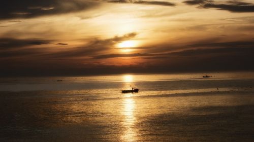 sunset boats ships