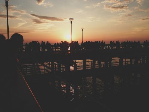 sunset pier people