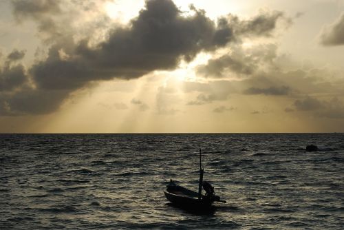 sunset sunbeams boat