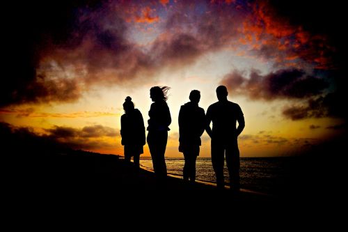 sunset beach silhouettes