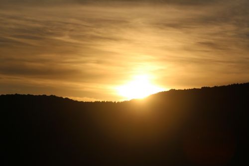 sunset mountainous forest area