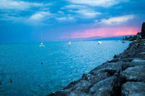 sunset sailboats lake