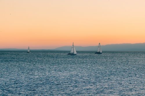 sunset sky sailboats