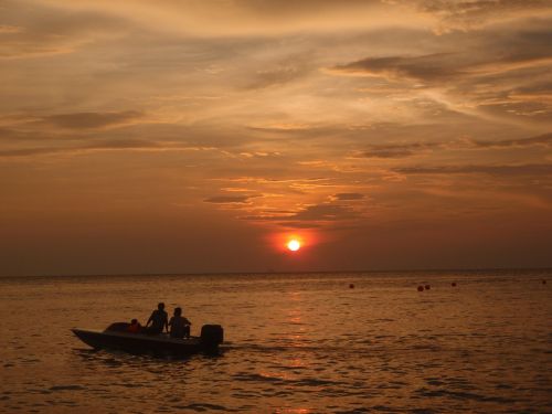 sunset boat fisherman