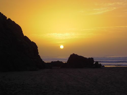 sunset silhouette beach