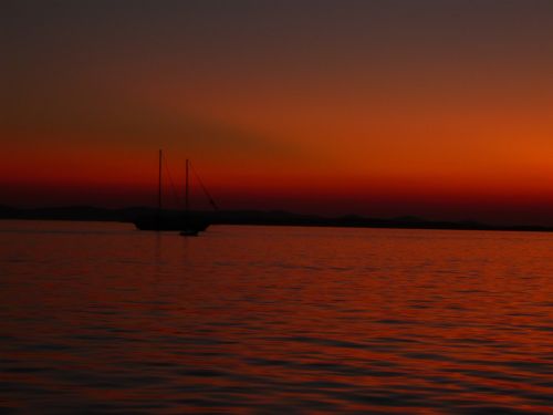 sunset at sea sailing boat marina
