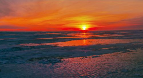 sunset on lake baikal winter ice