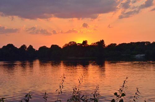 sunset on the river clouds water