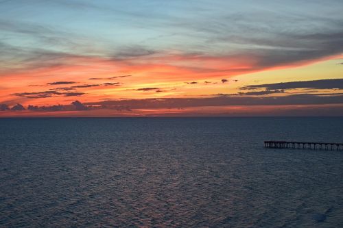 sunset over the pier seascape landscape