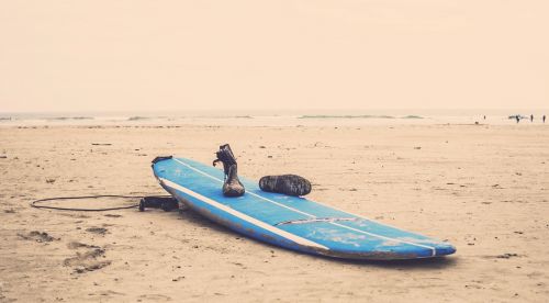 surfboard beach sand