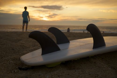 surfboard beach sand