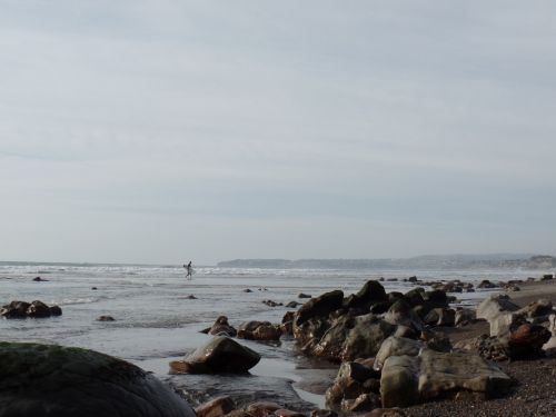 surfer rocks beach
