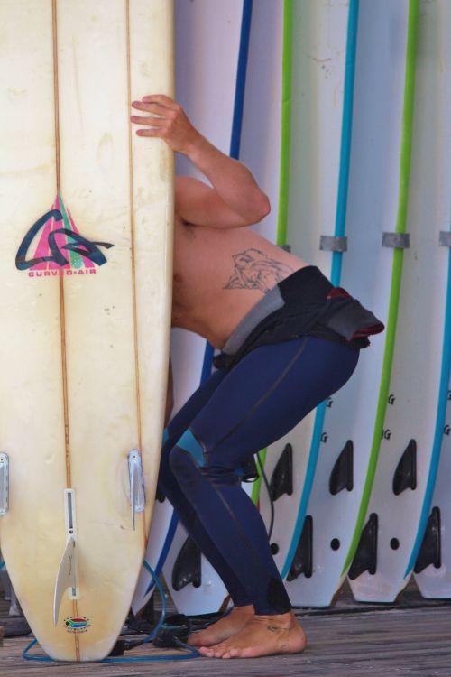 surfer surfboard wetsuit
