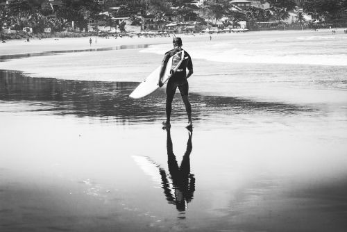 surfer surfing beach