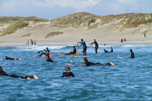 surfers surfing wait